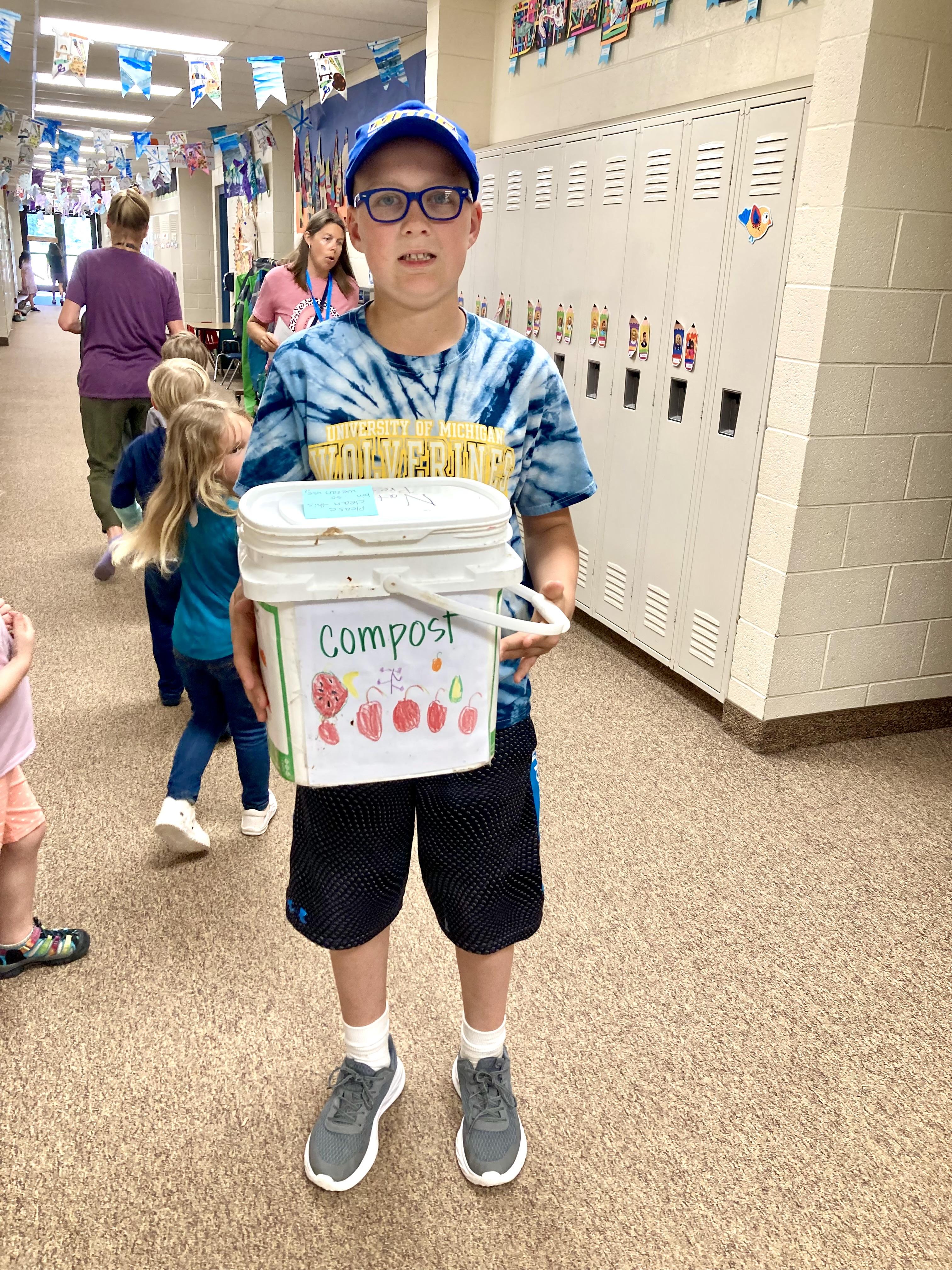 Liam Caterine with compost bucket