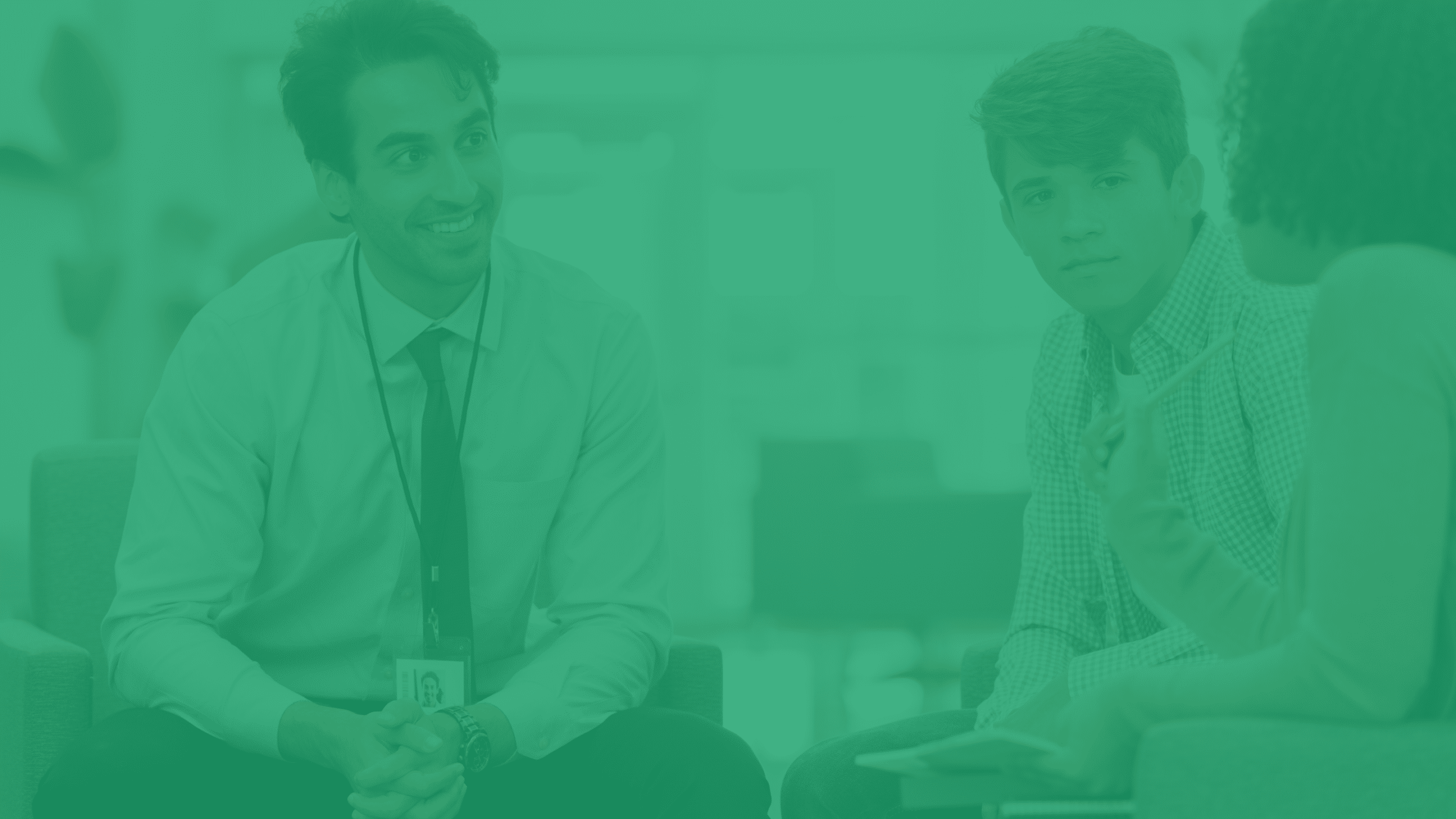 An image of teachers and a student sitting and conversing under a green overlay.